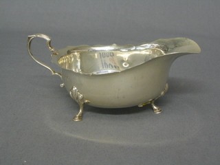 A Georgian style silver cream jug with cut border, by Walker & Hall with Jubilee mark, Birmingham 1934, 3 ozs