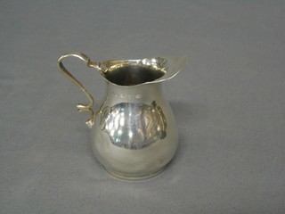 A Victorian silver cream jug, Sheffield 1897 2 ozs (some dents)