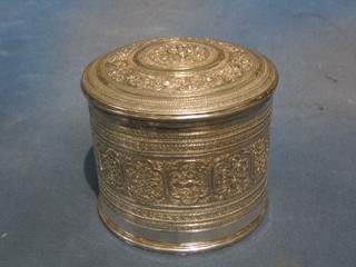 An Eastern embossed cylindrical silver jar and cover, the interior with liner, 5", 34 ozs