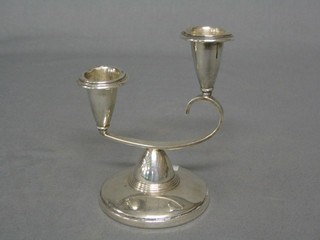 A modern silver plated twin light candelabrum raised on a spreading foot, 4"