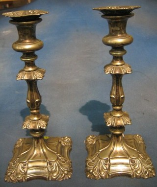 A pair of Rococo style silver plated candlesticks 12"