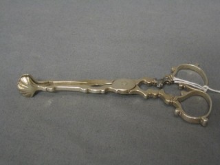 A pair of Victorian silver sugar nips Chester 1896 (1 arm f and r with old lead repair)