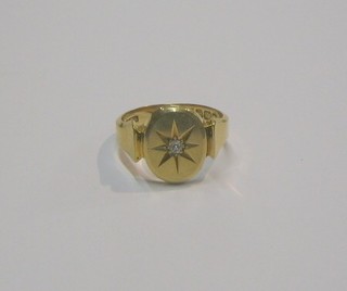 An 18ct gold dress ring set a small diamond