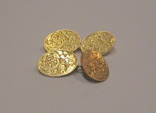 A pair of 9ct gold oval engraved cufflinks