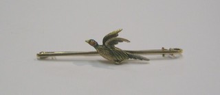 A lady's 15ct gold and enamelled bar brooch in the form of a cock pheasant in flight