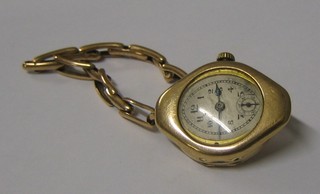 A lady's 1930's Rolex wristwatch with oval shaped dial and Arabic numerals contained in a gold oval case, movement signed Rolex 15 jewels and the case signed Rolex Swiss W D 1189823