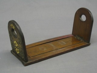 A pair of walnut expanding bookends with gilt metal decoration 