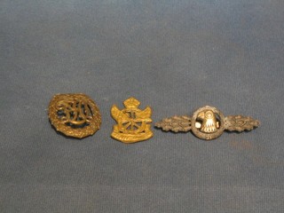 A Nazi German breast badge with monogram above Swastika, the reverse marked Wernstein Jena D.R.G.N.35 26 9, a Nazi German pilot wing? the reverse marked Jamme and Sohn Berlin and 1 other Continental badge