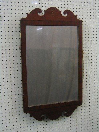 A Chippendale style rectangular plate mirror contained in a mahogany frame 25"