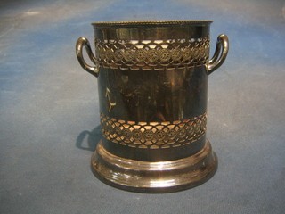 A circular pierced silver plated twin handled soda siphon holder