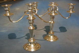 A pair of 3 light silver plated candelabrum