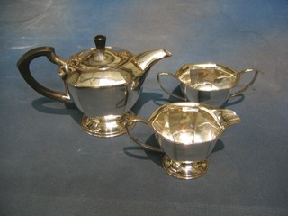 An octagonal shaped 3 piece silver plated tea service with teapot, twin handled sugar bowl and cream jug
