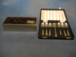 A rectangular silver plated cigarette box with simulated tortoiseshell lid 7" and 6 silver plated tea spoons and a caddy spoon, cased