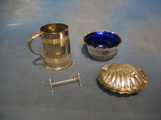 A silver plated pink tankard, a pair of silver plated knife rests, 2 modern silver plated stub candlesticks, 2 pierced circular silver plated bowls and a butter dish