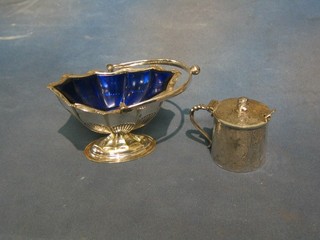 A Britannia metal mustard pot with blue glass liner, the finial in the form of an Egyptian head together with a boat shaped dish