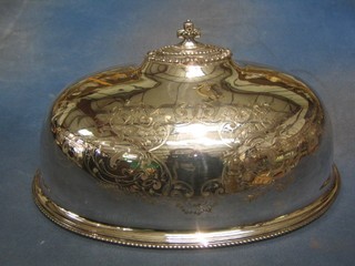 An oval engraved silver plated meat cover 14"