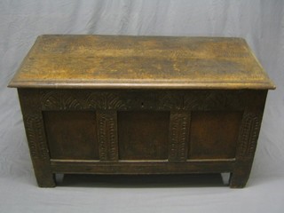 A 17th/18th Century carved oak coffer of panelled construction, with hinged lid 50"