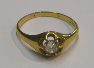A gentleman's gold gypsy ring set a diamond