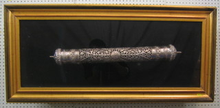 An Eastern pierced silver scroll case 25" contained in a glazed frame