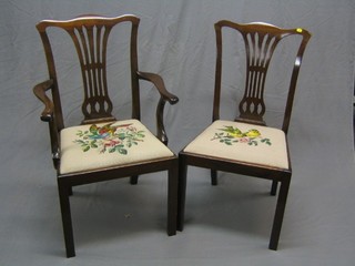 A set of 9 Hepplewhite style  dining chairs with pierced vase shaped backs and upholstered drop in seats (carver arm f and r)