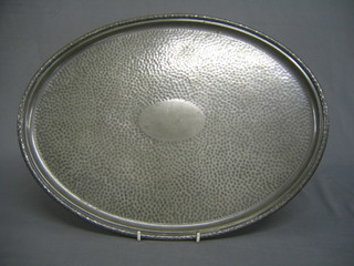 An oval planished pewter tea tray 18"