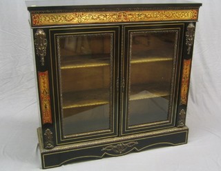 A 19th Century red boulle pier cabinet enclosed by a pair of panelled doors with gilt metal mounts throughout 46"