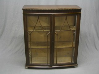 A Chippendale style display cabinet, the interior fitted adjustable shelves enclosed by astragal glazed panelled doors 36"