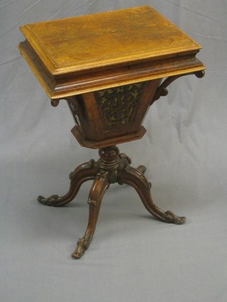 A rectangular walnut work table of conical form raised on pillar and tripod base 18"
