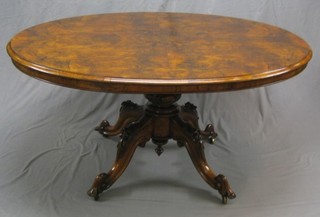 A Victorian circular snap top oval figured walnut Loo table, raised on a well carved column and tripod supports 60" (recently re-polished)