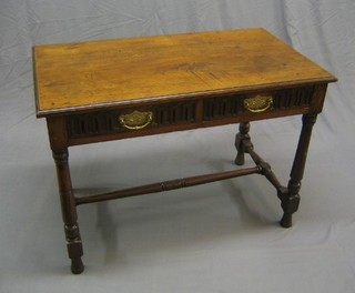 An 18th/19th Century oak side table fitted 2 frieze drawers raised on turned and block supports 40" (formerly with a box stretcher)