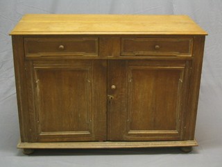 A 19th Century Continental oak dresser base, fitted a drawer above a double cupboard 50"