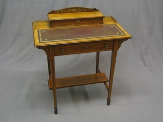 A Victorian bleached rosewood writing table with stationery box to the back with hinged lid, having a brass gallery and fitted a drawer, raised on square tapering supports ending in spade feet united by an H framed stretcher 30"