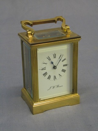 A 20th Century French 8 day carriage clock contained in a gilt metal case by J W Benson