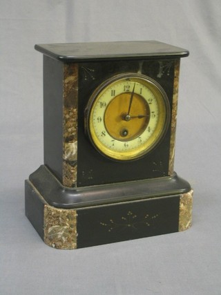 A Victorian French 8 day mantel clock with enamelled dial and Roman numerals contained in a black and grey veined marble case