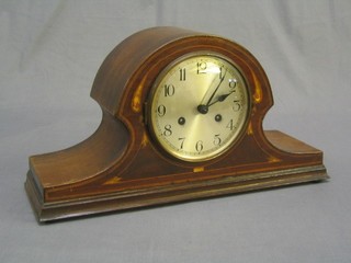 An Edwardian 8 day chiming mantel clock with silvered dial and Arabic numerals contained in an  Admirals hat shaped mahogany case