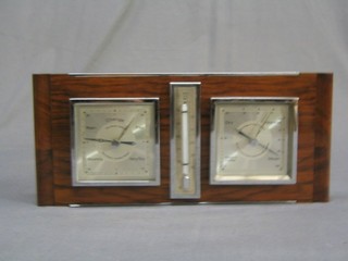 A 1950's aneroid barometer, thermometer and hydrometer contained in a walnut case 12"