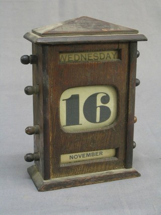An Edwardian oak perpetual calendar