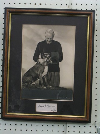 A signed black and white photograph of Brian Harrocks standing with bulldog, signed 9" x 7 1/2 