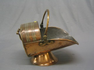 A 19th Century copper helmet shaped coal scuttle