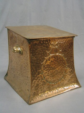 An Art Nouveau planished copper coal box with hinged lid 12"