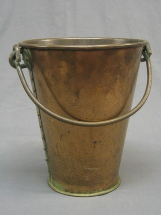 A waisted copper bucket with iron swing handle