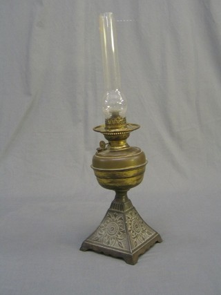 A 19th Century brass oil lamp reservoir raised on chamfered metal base