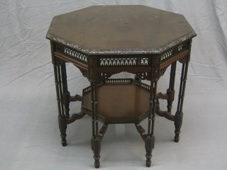 An Edwardian octagonal carved mahogany Chippendale style occasional table, raised on column supports 32"