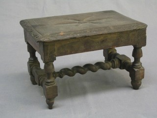 A Victorian rectangular carved oak stool raised on turned supports united by a spiral turned H framed stretcher 12" (some old worm)