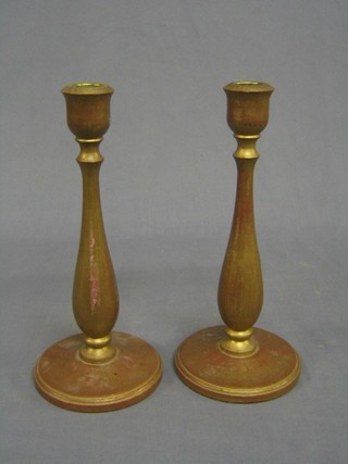 A pair of gilt painted turned candlesticks 10"