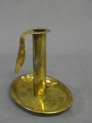 A 19th Century adjustable brass chamber stick