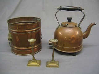An early copper electric kettle and a circular copper planter with lion mask handles