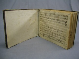 An 18th/19th Century score book containing handwritten scores of music