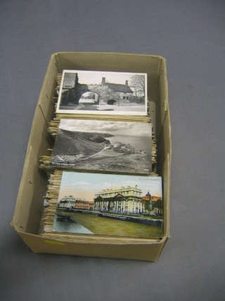 A large collection of black and white and other postcards