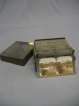 A box of stereoscopic slides including rural and historic scenes, castles, abbeys churches mostly by Underwood, boxed